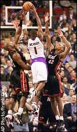 Tracy McGrady, Alonzo Mourning, P.J. Brown