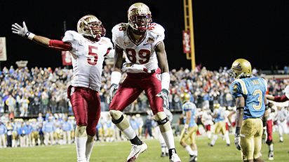 Chris Davis (5) and teammate Greg Carr (89)